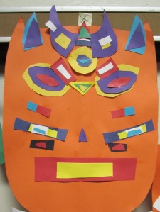 1st grade symmetrical masks inspired by Tribal African Masks- cut paper