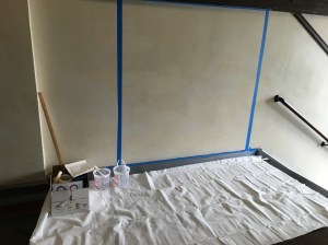 The 5'x5' area taped off and taped with paint and supplies in the box.